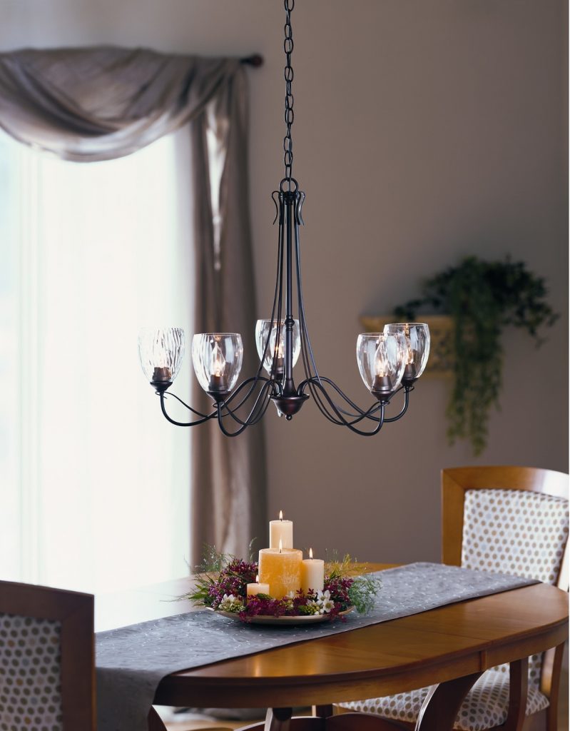 Lowes Glass Chandelier Shades above Wooden Dining Room Table with Centerpieces at Traditional House Concept