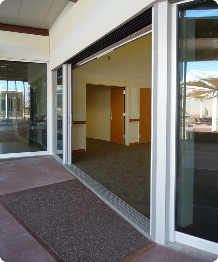 Masterful Valley Visitor Center Sliding Glass Doors Design with Brown Carpet