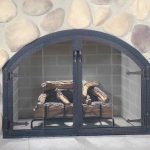 Pretty Stones Wall Concept with Black Colors for Custom Fireplace Doors Design