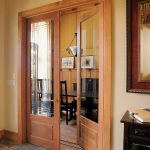 Brilliant Solid Wood Doors Interior for Cozy Dining Room with Dark Chairs and Long Black Table