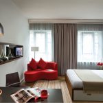 Captivating Red Lounge Chair inside Modern Bedroom Apartment Decorating Ideas with Wide Bed