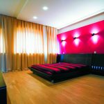 Fabulous Red Wall and Modern Wall Lamps in Spacious Bedroom using Cool Interior Design Ideas
