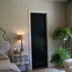 Minimalist House Interior Doors in Dark Color for Cozy Bedroom with Wide Bed and Classic Nightstand