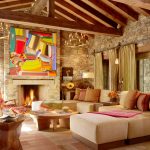 Rustic Living Room using Cool Interior Design Ideas with Colorful Abstract Painting and Stone Fireplace