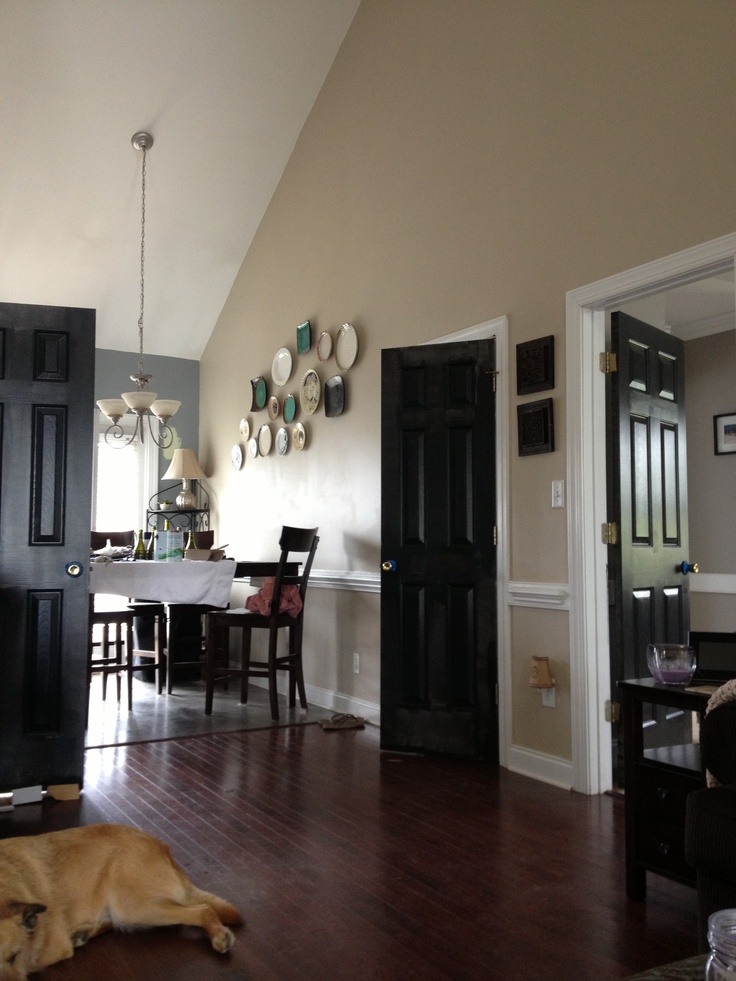 Traditional Area with Dark House Interior Doors near Black Dining Table and Old Fashioned Chairs