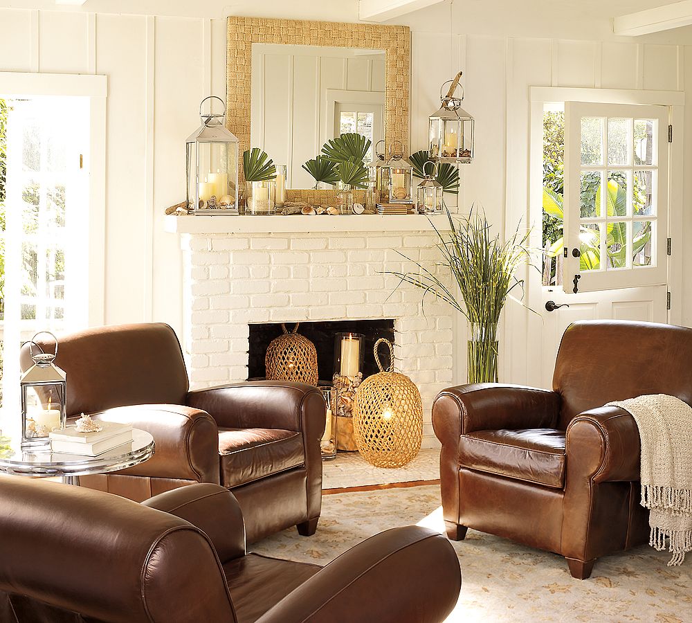 Vintage Lanterns in Traditional Sitting Room Decor with Brown Leather Sofas and Round Side Table