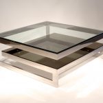 Glossy Contemporary Coffe Table with Glass Material and Metal Architrave on Sleeky Floor