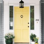 Glossy  Yellow Front Door Color Ideas with Long Galass Accent plus Preety Flower