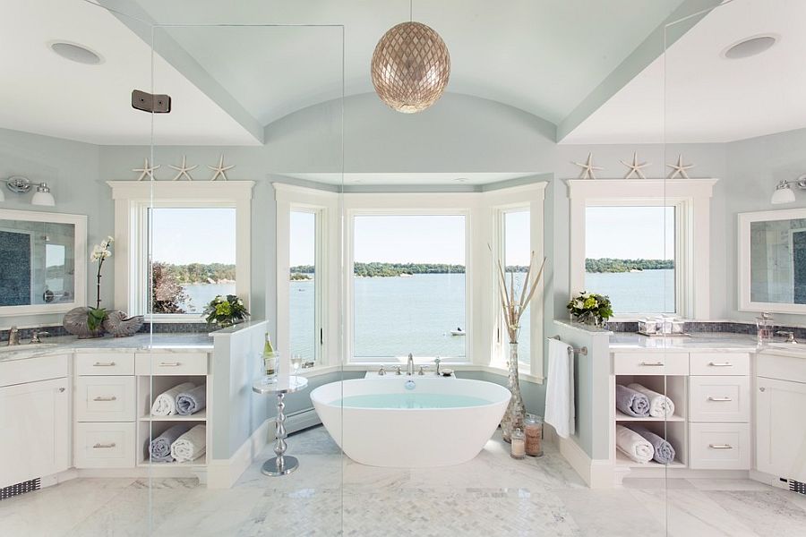 Adorable Chandelier for Classic Luxury Bathrooms with Cute Bathtub facing Lake plus Big Glass Window
