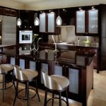 Alluring Bar Stools and Table using Sink above Ceiling Lamps plus Kitchen cabinet Glass Doors
