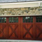 Fabulous Wood Carriage Style Garage Doors with Stone Wall and Downlight on White Ceiling