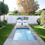 Iddylic Small Swimming Pools Designs with Cozy Sunbathe Chair plus White Fence and Green Grass