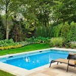 Lovely Small Swimming Pools Designs with Cute Sunbathe Chair on Floor plus Yellow Umbrella