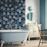 Luxurious Bright Bathroom Ideas with Sweet Wallpaper side Cute Round Mirror plus Simple Bathtub on Clean Floor plus Wood Chair near White Dustbin