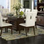 Luxurious Classic Dining Table Designs with White Flowers side Simple Tableware plus Nice Carpet