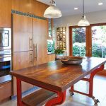 Marvelous Wooden Movable Kitchen Island under Glass Bowl Chandelier beside Cabinet and Microwave