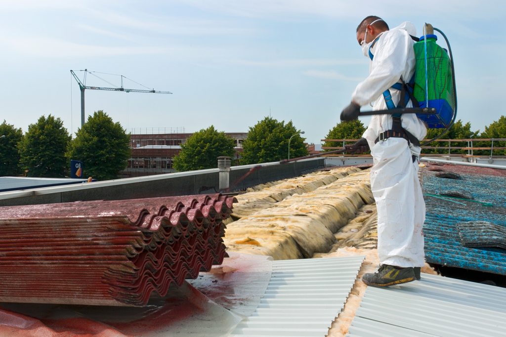 Worker during the removal of the asbestos roof