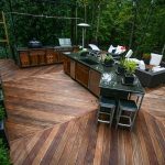 Appealing Wooden Flooring Design of Modular Outdoor Kitchens Furnished with Sleek Kitchen Island Completed with Sink and Griller