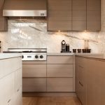 Contemporary Kitchen Created on Hardwood Laminate Flooring and Enhanced with Marble Backsplash Ideas