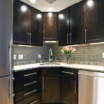 Cool Grey and Black Themed Traditional Kitchen on Hardwood Flooring Enhanced with Tiled Backsplash Designs