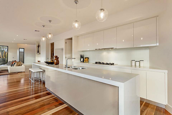 Inspiring White Kitchen with Modern Kitchen Lighting Furnished with Cupboards Plus Island Completed with Sink and Stove