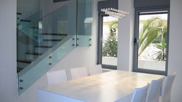 Marvelous Modern Dining Room Tables Applying White Color Furnished with Crystalist Chandelier and Chairs