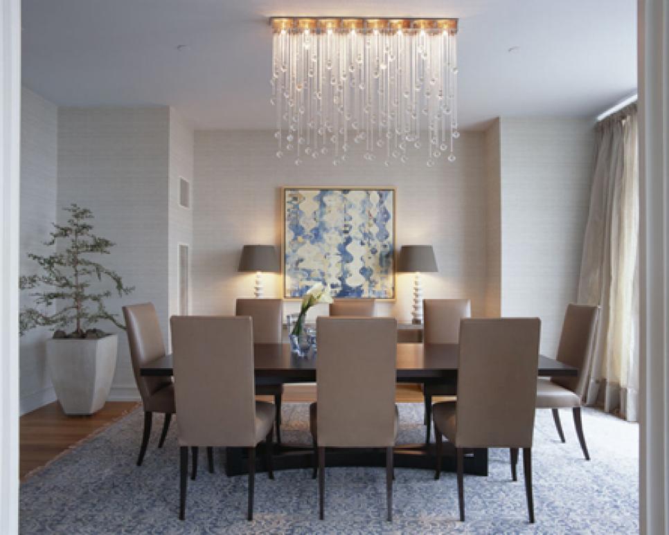 Modern Dining Space Decorated using Apartment Decorating Concept Enlightened by Crystal Hanging Lamps
