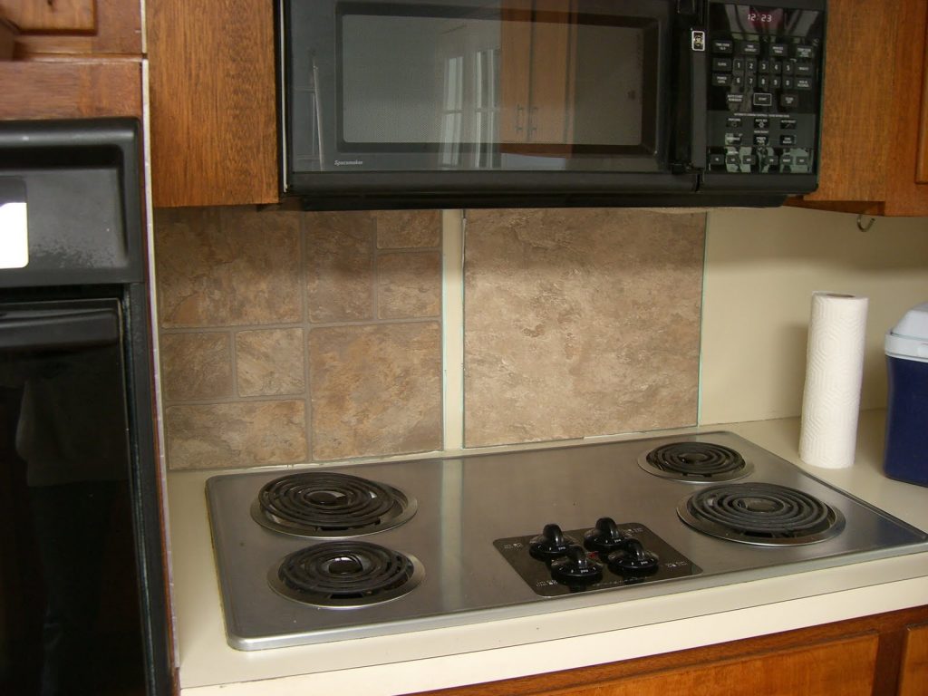 Simple Backsplash Designs for Traditional Kitchen Combined with Wood Wall Storage and Modern Stove