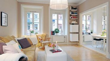 Spacious Apartment Decorating Ideas Created on Hardwood Flooring Furnishing Modern Sofa and Coffee Table