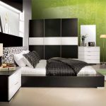 Black and white bedroom with green wall as the sparking color contrast in fresh nuance