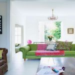 Bright Colored Living Room with Green Sofas and Brown Leathered Couch