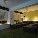 Dark Relaxing Room in large Size with Recessed Lamps Set on one SIde of The Wall