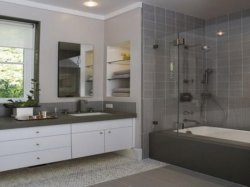 Mater Bathroom with Sleek White container habing Grey Countertop and Dark Grey bathtub Platform