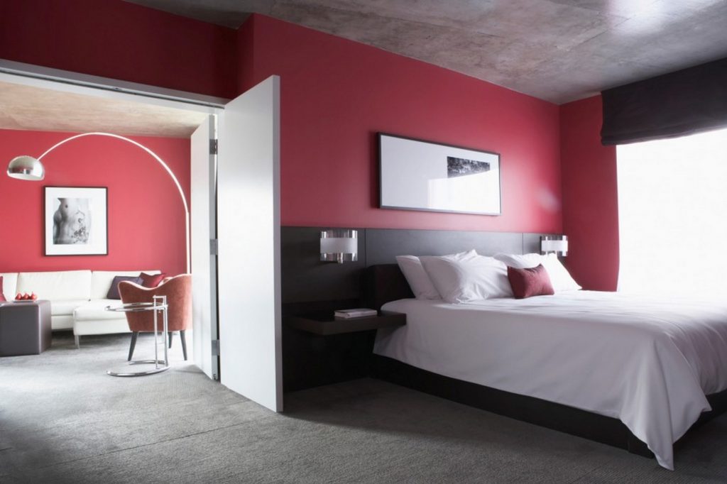 Red Walls in Bedroom INterior in Neutral Palette and Tall Floor Lamp