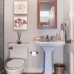 Small Bathroom in White Furnished with Classic Inspired Furniture and Accessories