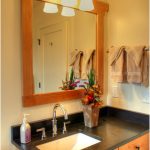 Small Bathroom with Big Wall Mirror Framed on Wood and Wood Bathroom Storage