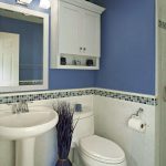Tiny Bathroom with Beacy Theme Designed in White and Blue Colors with Blue Vase