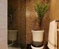 Tiny Bathroom with Small SIzed Tile Wall in Brown Decorated by Green Plants
