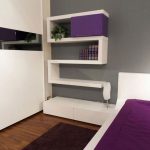 Updated Bedroom in Masculine Look with Mounted Shelving Unit in WHite Color