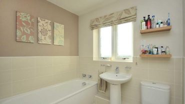 (7) Flower Wall Arts on Grey Wall inside Tiny Family Bathroom Ideas with Pedestal Sink and Long Bathtub